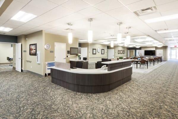 Bright interior common area with reception and seating