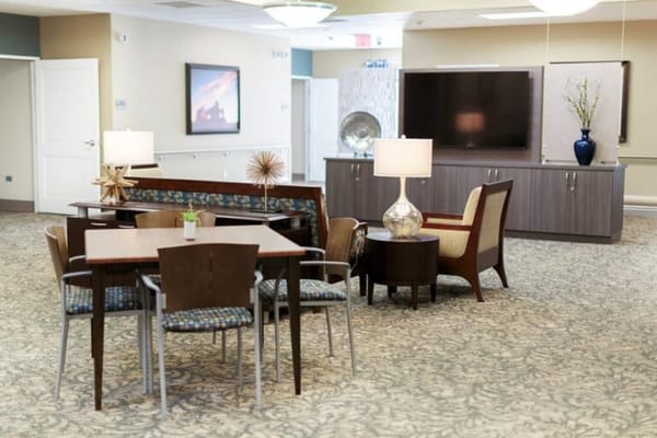 Bright interior common area with seating and tables