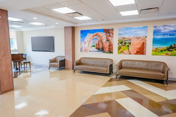 Bright interior common area with artwork and seating