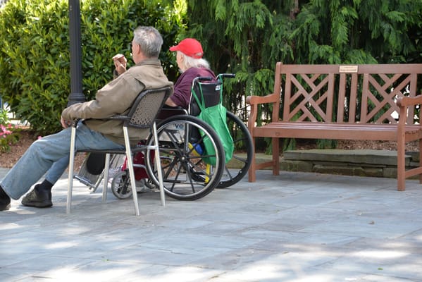 Two residents enjoying outdoor seating