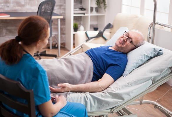 Caregiver interacting with a senior resident in a room