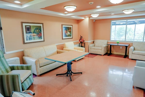 Bright common area with seating and artwork