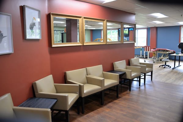 Interior hallway with seating and mirrors