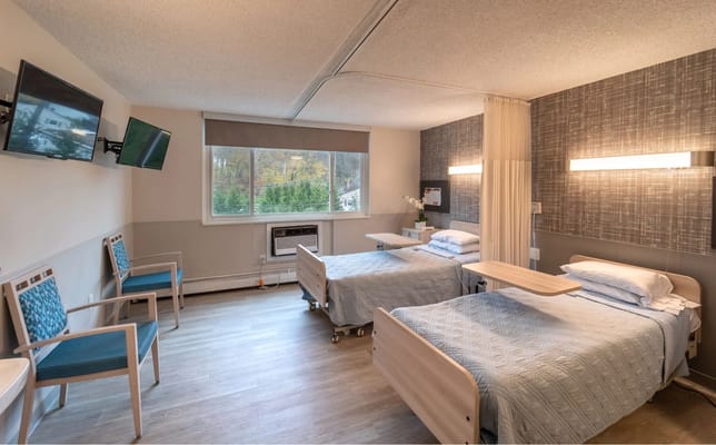 Interior view of a shared resident room with two beds