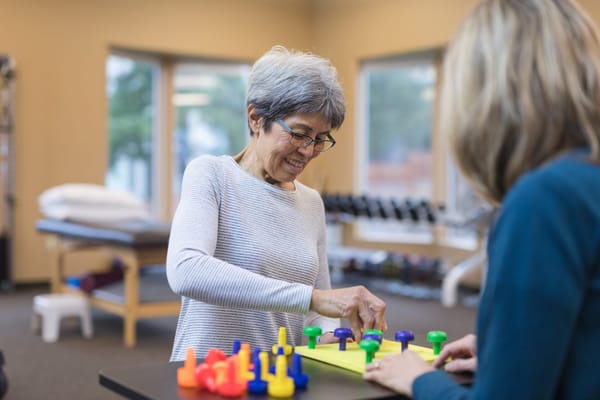 Residents participating in a group activity in an activity room