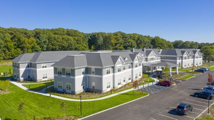 Aerial view of a senior living facility with parking