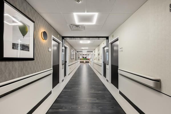 Well-lit hallway in a senior living facility