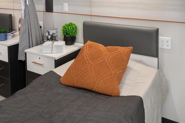 Cozy private resident room with a bed and decor