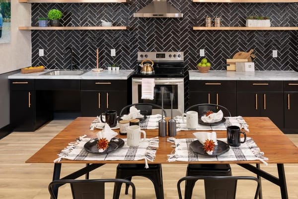 Stylish dining area with table set for meals