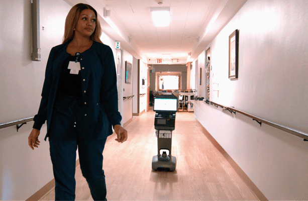 Staff member walking in a hallway of the facility