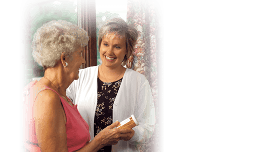 Caregiver discussing medication with a resident