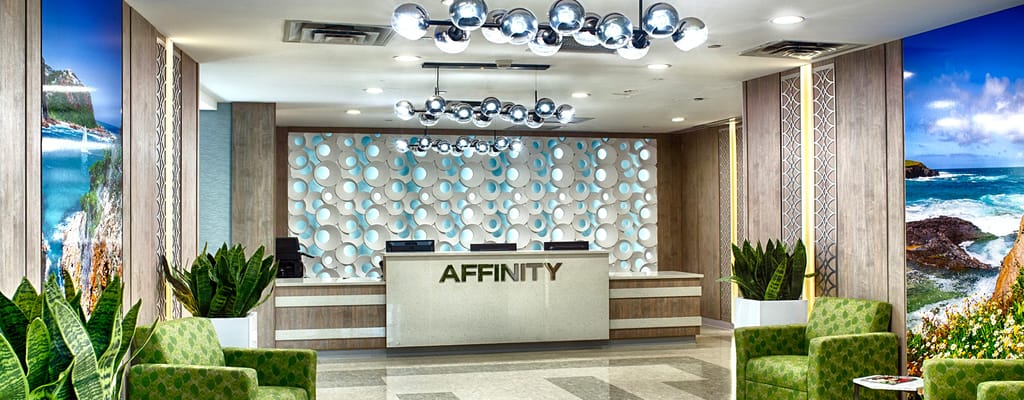 Bright lobby area with modern decor and reception desk.