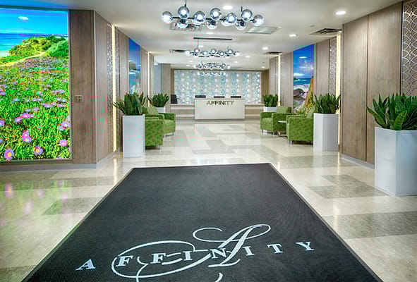 Bright lobby area with modern furniture and floral decor