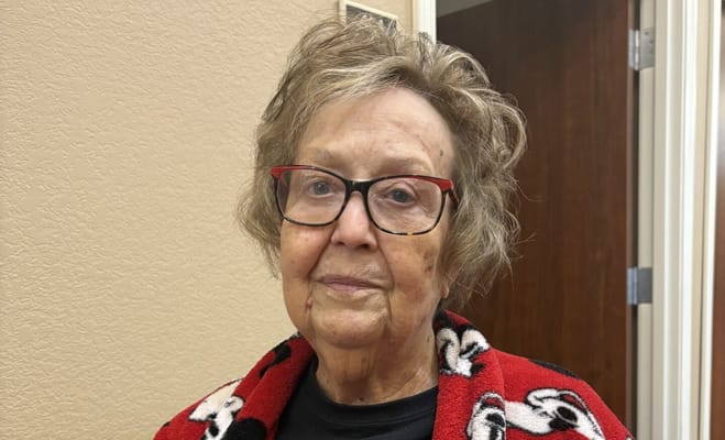 Senior woman with glasses in a cozy setting