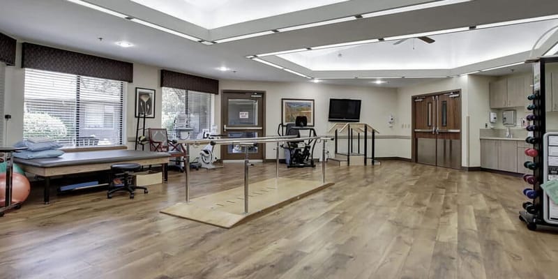 Bright activity room with rehabilitation equipment