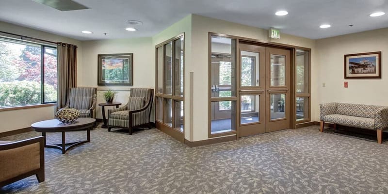 Bright common area with seating and natural light