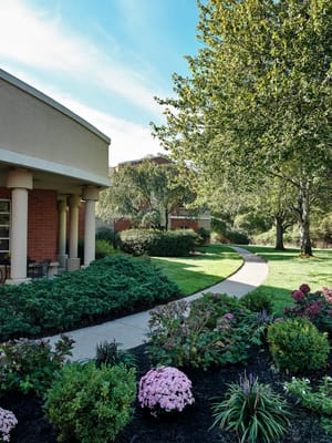 Pathway through landscaped gardens at the facility