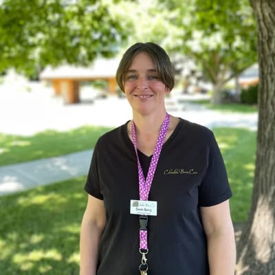 Staff member outdoors in a green area