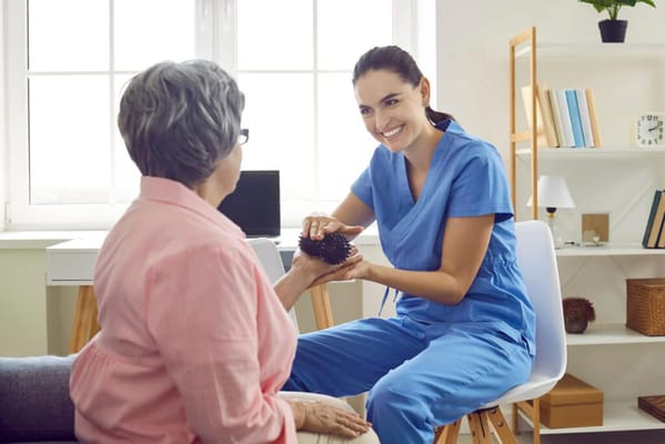 Healthcare staff engaging with a senior resident