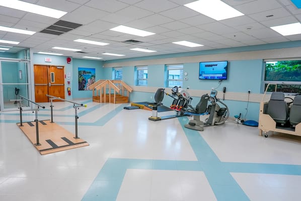 Physical therapy room with equipment for rehabilitation