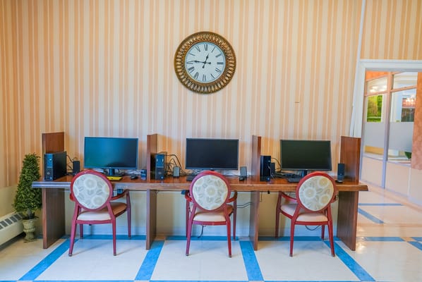 Interior computer area with desks and monitors