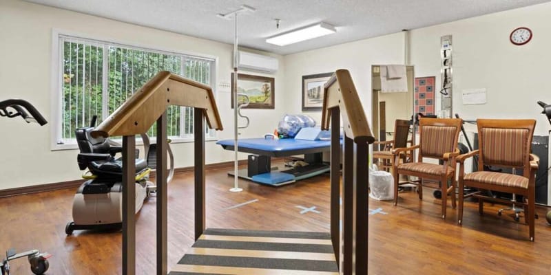 Physical therapy area with equipment and seating
