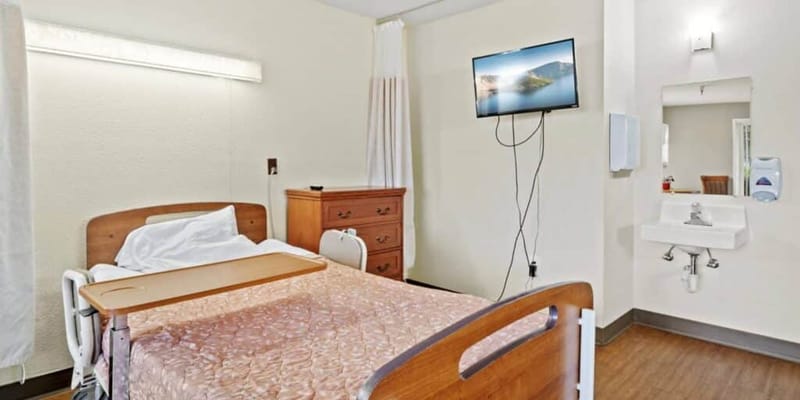 Clean and simple private resident room with amenities