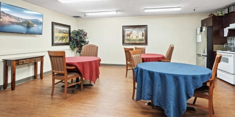 Dining area with tables and framed artwork