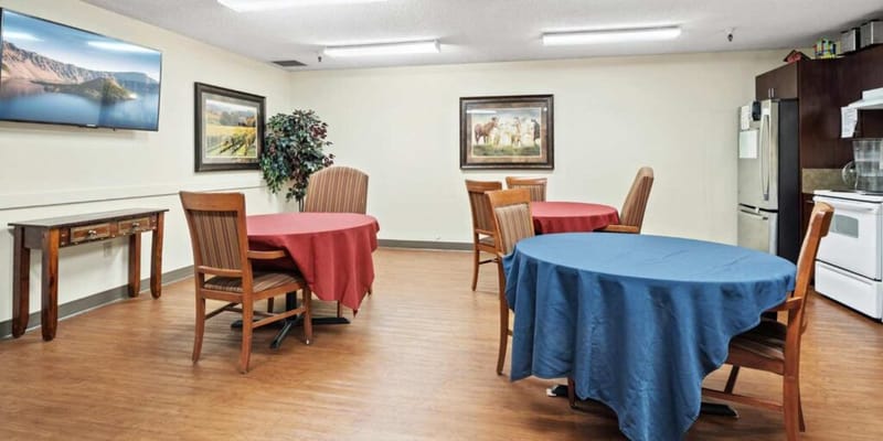Dining area with tables and framed artwork
