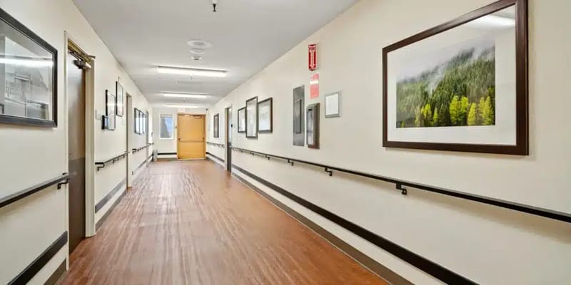 Hallway with framed artwork in a nursing home