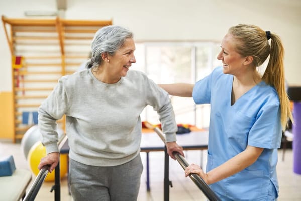 Senior resident with staff in a therapy session