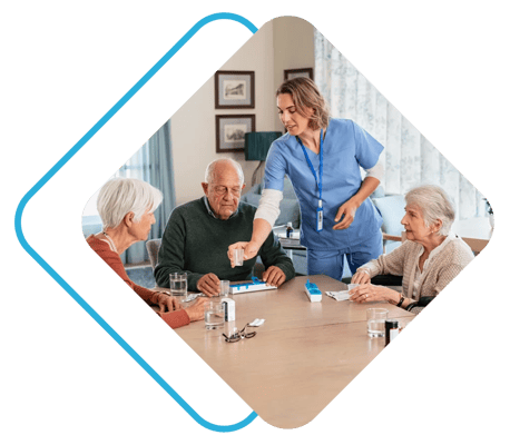 Staff assisting residents in a common area