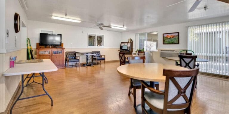 Common area with tables and seating in the facility