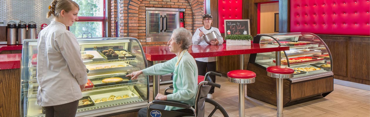 Residents enjoying desserts in the dining area