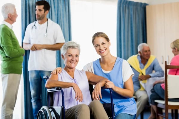 Nurse assisting a resident in a lively common area