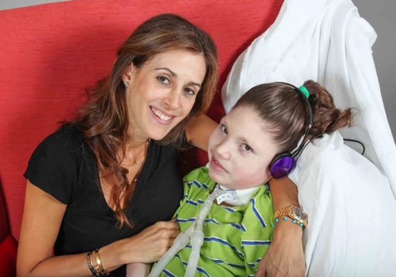 A woman with a child in a care setting