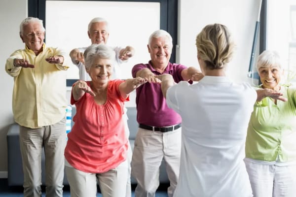Seniors participating in a fitness class indoors