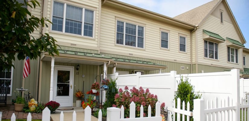 Front exterior of a residential care facility with flowers