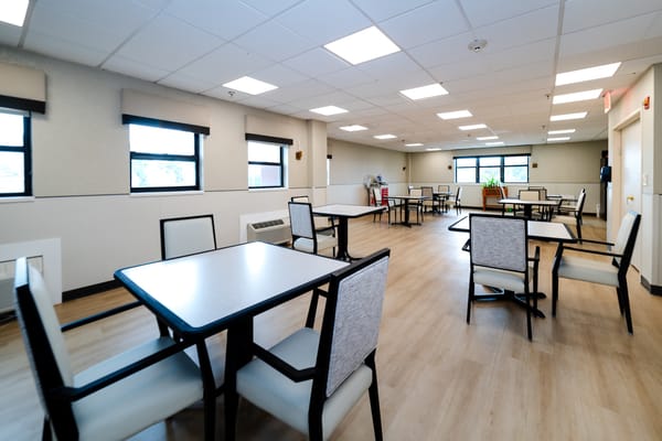 Bright dining room with tables and chairs