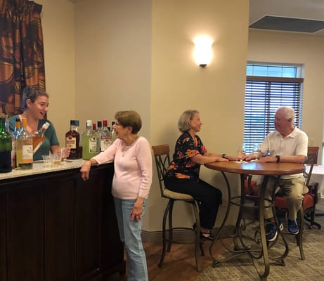 Residents enjoying drinks at a social gathering