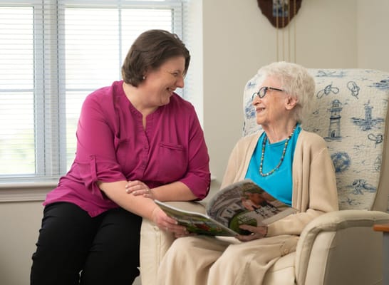 A caregiver and a resident sharing a moment together