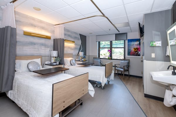 Bright and welcoming shared resident room with two beds