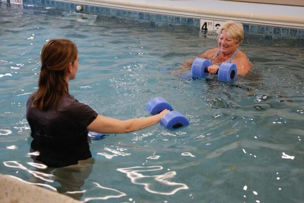 Residents participating in a water aerobics class