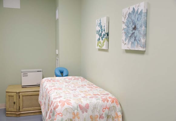 Cozy resident room with floral bedding and decor