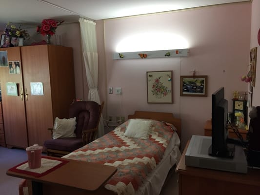 Cozy resident room with bed and decorations