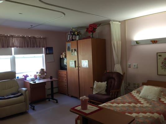 Cozy private room with a bed and seating area