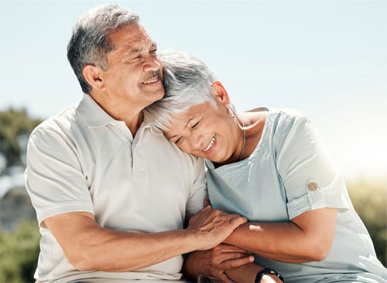 Senior couple sharing a joyful moment outdoors