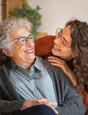 Two women smiling and enjoying each other's company
