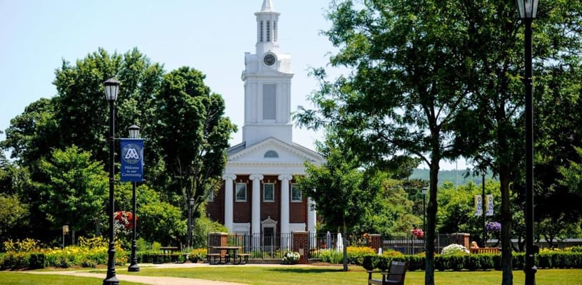 Exterior view of the facility with gardens and trees