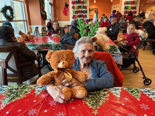Residents enjoying a festive activity with teddy bears